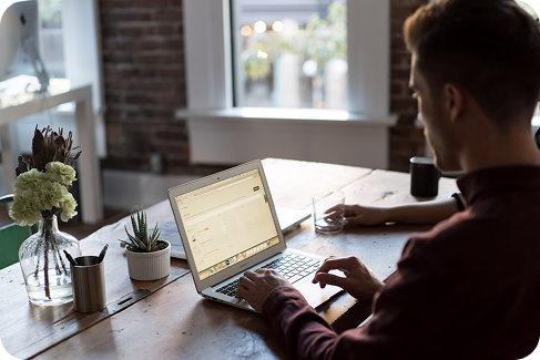 Developer working on laptop with no-code solutions